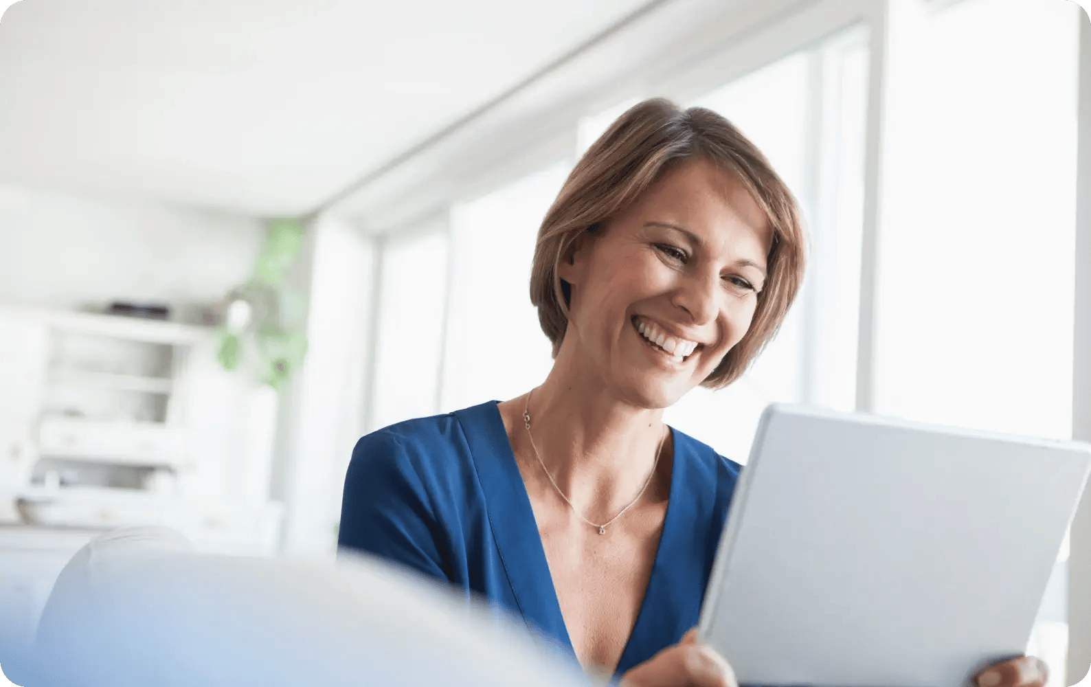 a woman holding a tablet
